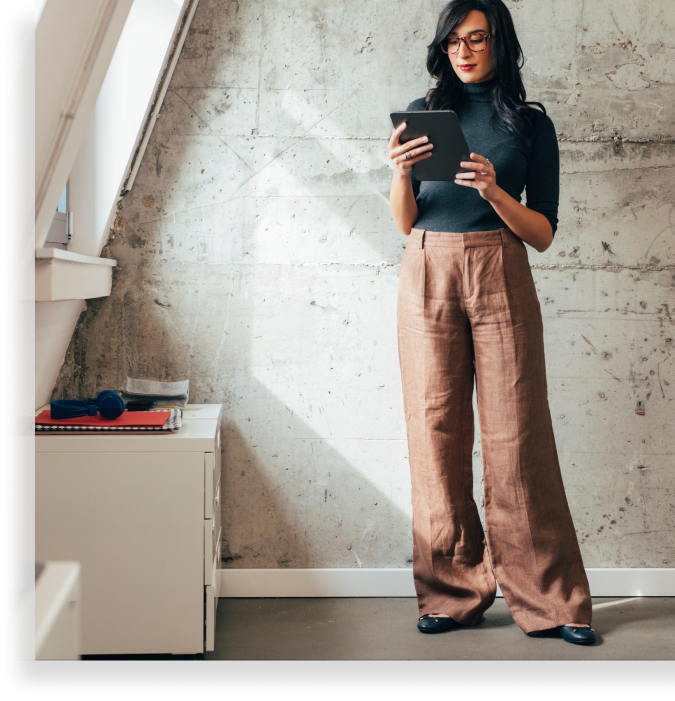 Beautiful Elegant Caucasian Businesswoman Using a Digital Tablet at the Office